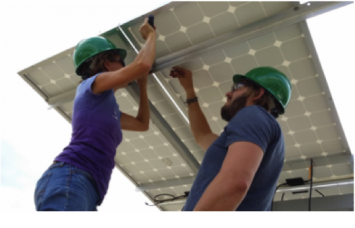 Figure 4.  Participants in the STEM Solar Institute work on a pole mounted photovoltaic system.